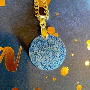 Handmade 19” necklace. Silvertone.  Pendant is opaque white with blue glitter.